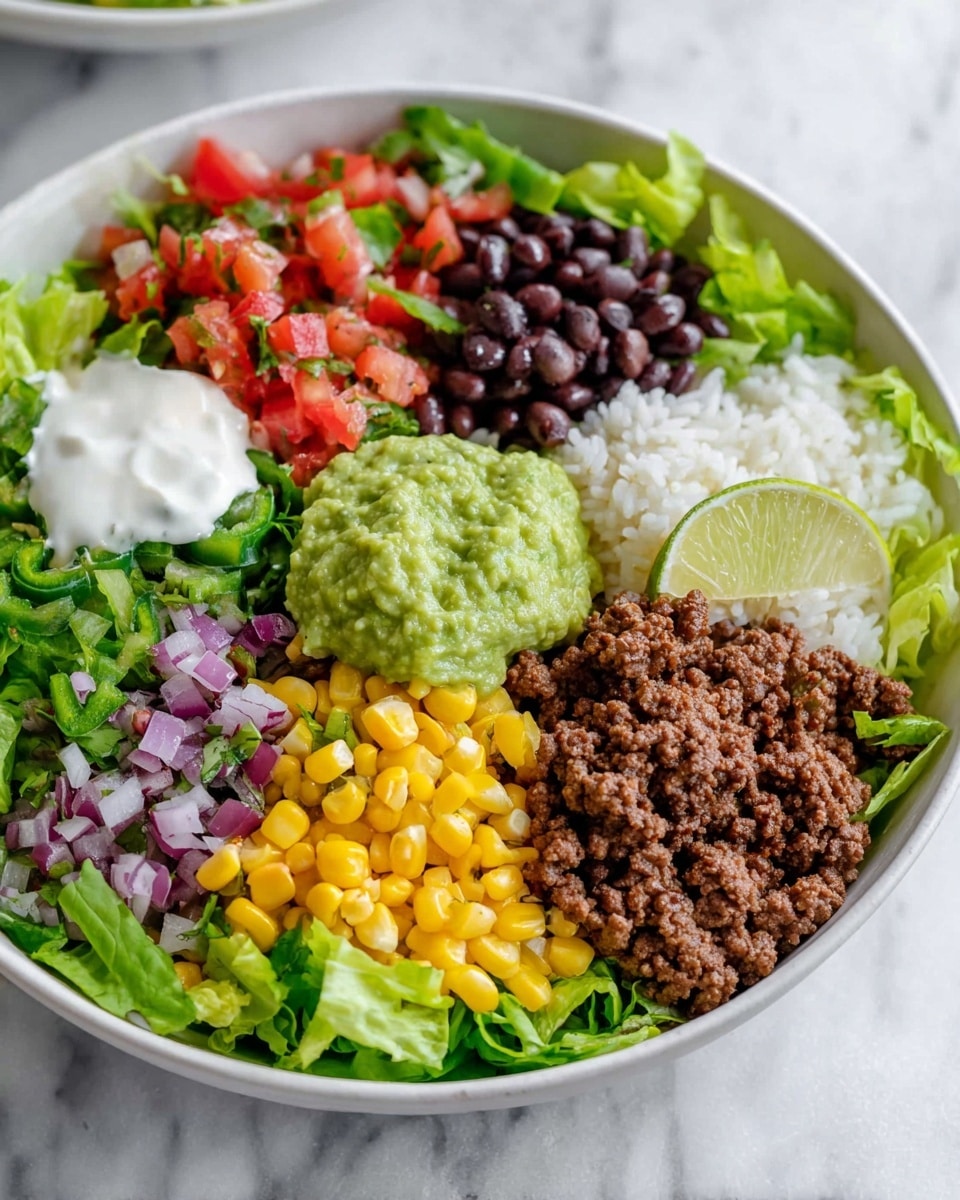 A bowl of layered burrito ingredients arranged neatly in sections. The bottom layer is green leafy lettuce, topped with a scoop of white sauce on the left side. Next to it, there is diced red tomato mixed with bits of purple onion and green peppers. Above that, dark black beans and a scoop of fresh green guacamole sit beside a wedge of light green lime. In the center, browned ground beef is placed beside yellow corn mixed with bits of onion and green peppers. On the right side, there is a portion of white rice. The bowl is white and set on a white marbled surface. Photo taken with an iphone --ar 4:5 --v 7