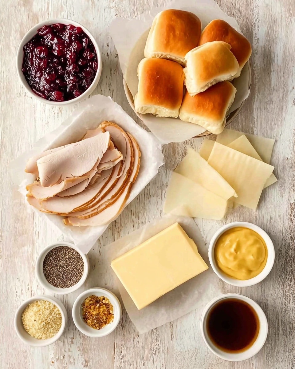 The image shows a top-down view of various food items neatly arranged on a white marbled surface. There is a small white bowl filled with dark red cranberry sauce at the top left, next to a white plate piled with soft, golden small sandwich rolls at the top right. Below the cranberry sauce is a white bowl containing thin, folded slices of roasted turkey with a light brown edge. To the right of the turkey slices, there are several pale yellow slices of cheese layered on a white parchment paper. Below the turkey is a small rectangular piece of butter. At the bottom left, a white bowl holds a mix of black, beige, and brown spices. Next to it on the right is a small white bowl with smooth yellow mustard, and to the far right is another small white bowl containing a dark brown liquid. The overall color palette is warm and neutral, with a focus on natural food textures and a white marbled background. photo taken with an iphone --ar 4:5 --v 7