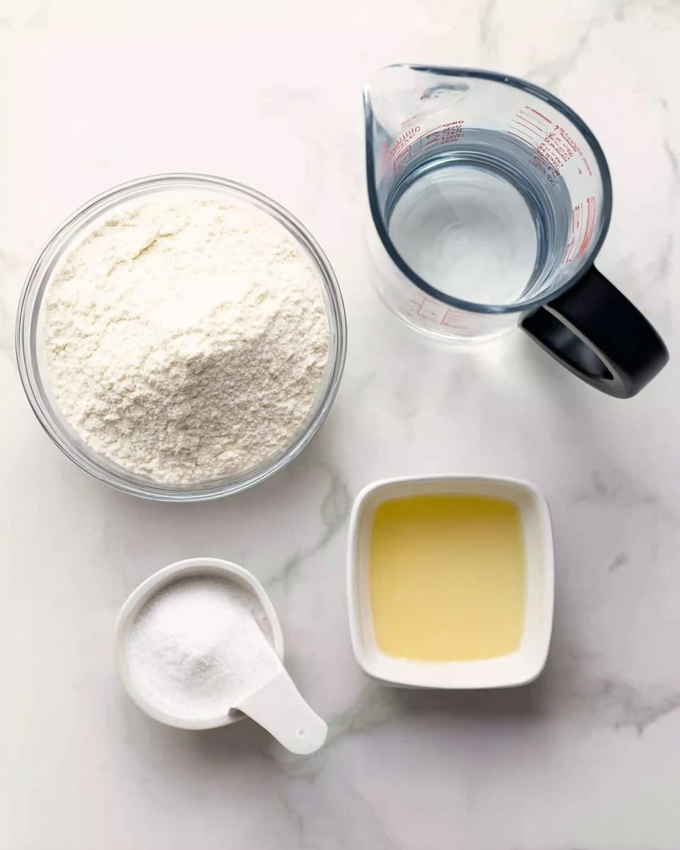 The image shows four containers on a white marbled surface. At the top left is a clear glass bowl filled with fine white flour. To the right, there is a transparent measuring jug with a black handle, filled halfway with clear water. Below the flour bowl, there is a small white ceramic scoop filled with fine white salt. Next to the scoop, on the right, is a small white square bowl holding pale yellow oil. Photo taken with an iphone --ar 4:5 --v 7