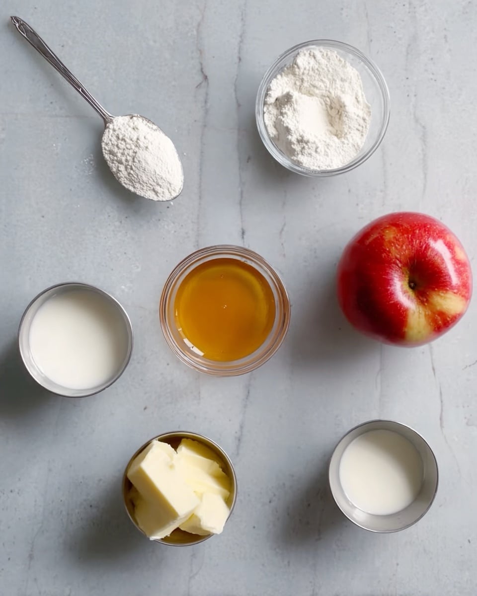 The image shows six small glass and metal containers placed on a white marbled surface. From top left, there is a silver spoon holding white flour with a smooth texture. Next to it is a small glass bowl with a mound of white powder, likely baking powder or flour. To the right is a small glass bowl filled with golden honey. Far right is a whole shiny red apple with a small brown stem. At bottom left is a silver cup filled with a white liquid, probably milk. Bottom center is a silver cup holding soft yellow butter. Bottom right is another silver cup containing a small amount of white liquid. The containers are evenly spaced, and lighting is soft and natural. Photo taken with an iphone --ar 4:5 --v 7
