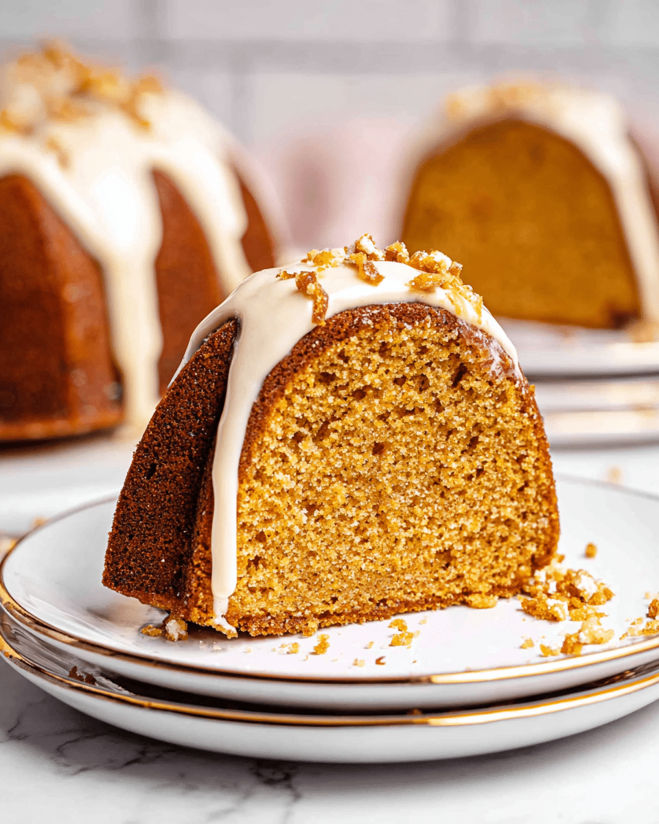 The image shows a thick slice of bundt cake placed on a white plate with a thin gold rim, which is stacked on another similar plate against a white marbled background. The cake has two visible layers: a dense golden brown crumb layer and a smooth light cream icing that drips down the top center and edges of the slice. Small bits of nuts or caramelized toppings sit on top of the icing, adding texture contrast. Crumbs are scattered lightly on the plate in front of the slice. In the blurred background, two more slices of the same bundt cake, also iced, are visible. Photo taken with an iphone --ar 4:5 --v 7