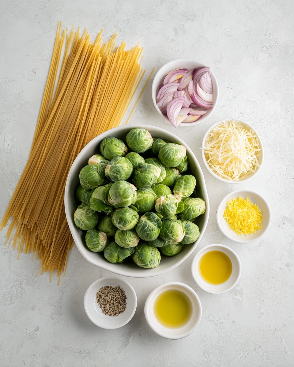 A top-down view of raw ingredients arranged on a white marbled surface with a large white bowl of fresh green Brussels sprouts in the center. To the left, long strands of uncooked spaghetti lay flat, spreading slightly downward. Above the spaghetti, three small white bowls hold different ingredients: thinly sliced shallots with pale purple and white layers, finely minced garlic with a soft yellow tone, and a pile of shredded pale yellow cheese. To the right of the Brussels sprouts bowl, small piles of bright yellow lemon zest and three additional small white bowls contain olive oil with a rich golden hue, light yellow lemon juice, and a mix of salt and black pepper. photo taken with an iphone --ar 4:5 --v 7