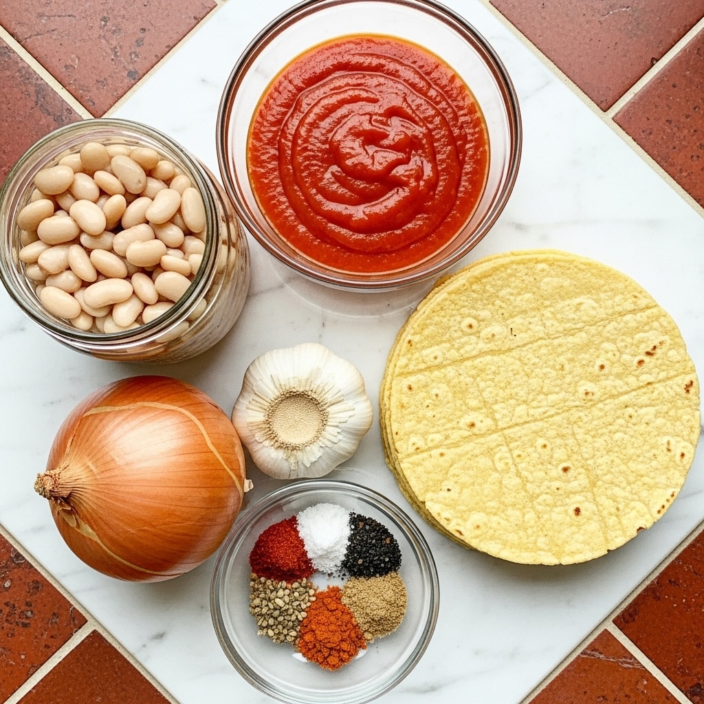 The image shows several cooking ingredients arranged on a white marbled surface with a warm, reddish-brown tiled pattern. There is a stack of light yellow corn tortillas on the right, with a smooth and slightly grainy texture. Above the tortillas is a clear glass bowl filled with bright red buffalo sauce that looks smooth and shiny. On the left, there is a jar of pale white beans with a soft, wet appearance. Below the jar is a round onion with a golden-brown outer layer and dry, papery skin. Next to the onion is a garlic bulb with white, slightly rough skin. In front of the garlic is a small clear glass bowl containing different colorful spices, including red, black, white, and brown powders, arranged in small portions side by side. Photo taken with an iphone --ar 4:5 --v 7