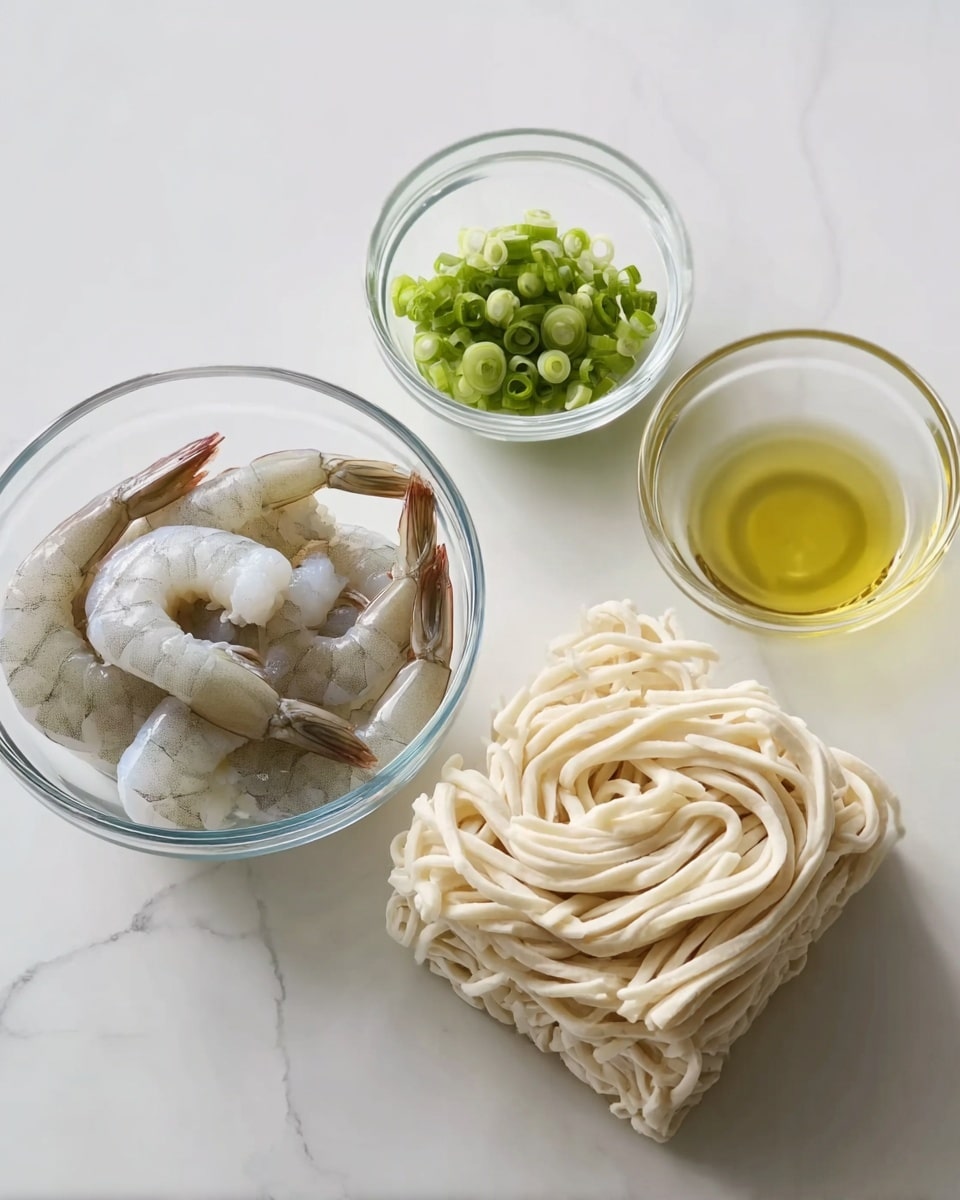 The image shows four clear glass bowls placed on a white marbled surface. The largest bowl at the bottom right holds a block of pale beige noodles with thick, round strands. Above it and slightly to the left is a medium bowl containing several raw shrimp with a translucent gray color and visible tails. To the right of the shrimp bowl is a small bowl filled with light yellow oil. Above the noodle bowl and to the left is the smallest bowl with bright green chopped spring onions. The scene is bright and clean, with natural lighting highlighting the textures of the ingredients. photo taken with an iphone --ar 4:5 --v 7