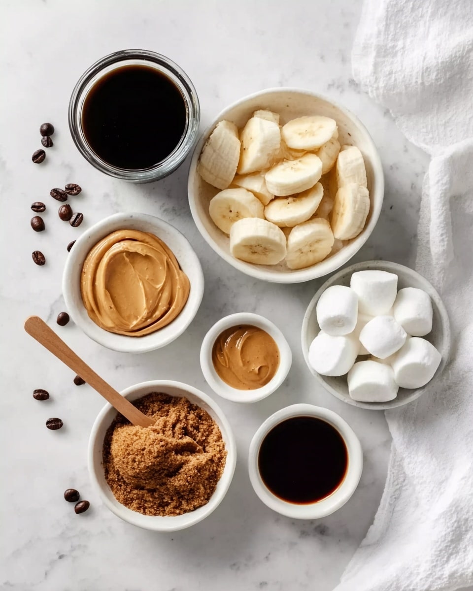 The image shows six white bowls placed on a white marbled surface. The top center bowl contains sliced bananas, light yellow with a soft texture. To the upper left, a tall glass filled with dark black coffee stands. Below it, a small white bowl holds smooth, light brown peanut butter. In the center bottom, a white bowl contains crumbly, dark brown brown sugar with a wooden spoon resting inside. To the right of the brown sugar, a small white bowl with dark brown syrup is placed. In the lower right corner, a white bowl contains round, translucent white marshmallows. A white cloth is folded and placed in the top right corner. Coffee beans are scattered around the bowls. Photo taken with an iphone --ar 4:5 --v 7