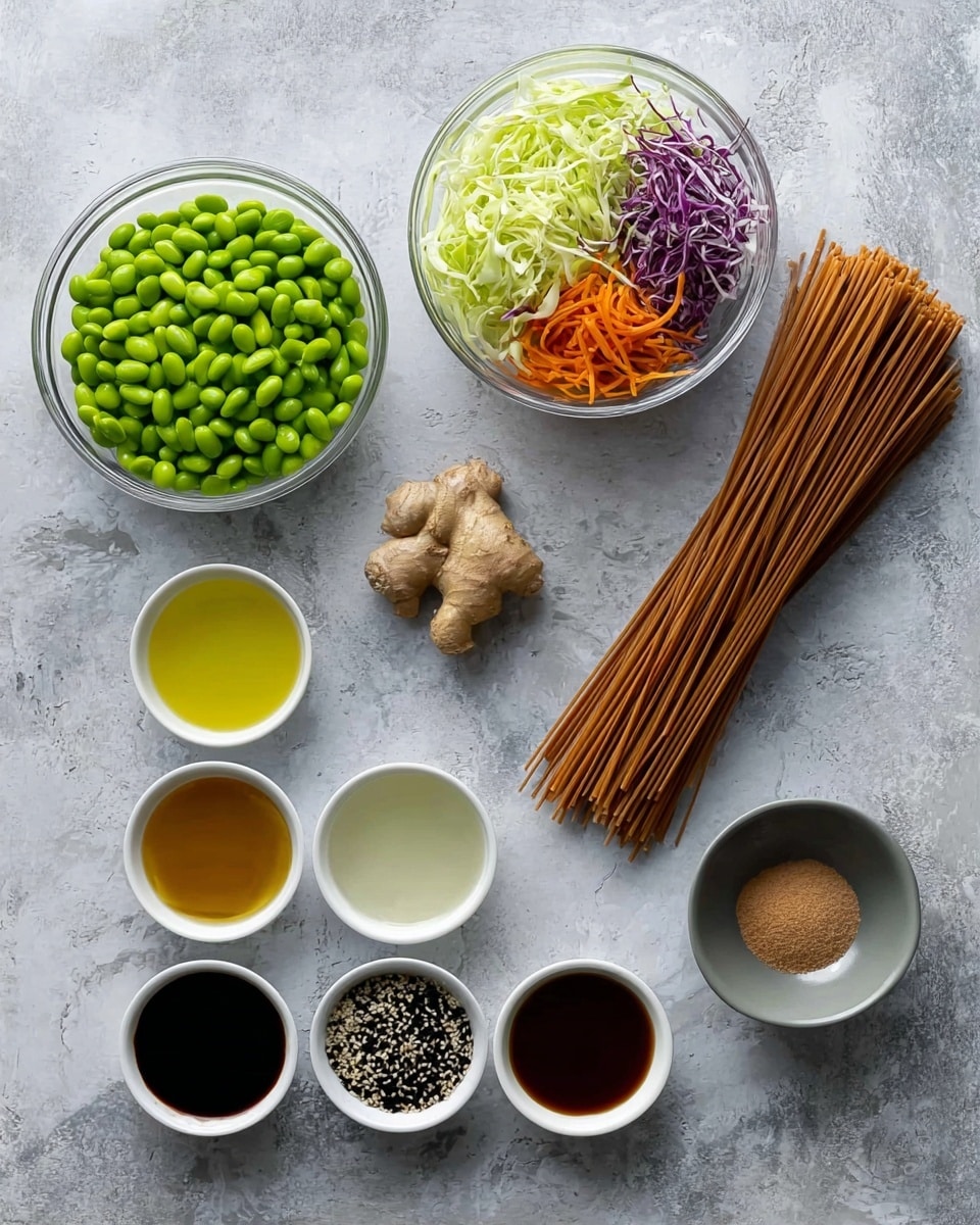 The image shows various ingredients neatly arranged on a white marbled surface. On the top row from left to right, there is a clear white bowl full of bright green edamame beans, another clear white bowl filled with shredded vegetables including light green cabbage, orange carrots, and purple cabbage, and a bundle of long brown noodles placed side by side. Below them, near the center, is a piece of light brown ginger root, two small white bowls with light yellow oil and clear liquid. In the bottom row, there are five small white bowls containing dark soy sauce, golden honey, mixed black and white sesame seeds, brown liquid sauce, and white salt. A small gray bowl on the top right holds a light brown powder. The items are evenly spaced and clearly visible. Photo taken with an iphone --ar 4:5 --v 7