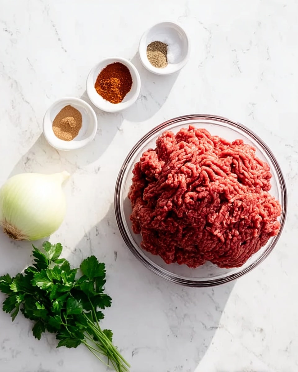 A clear bowl filled with a large mound of red ground meat sits on top of a white marbled surface in the center of the image. To the left, there is a half white onion with a light tan outer layer resting on the white marbled surface. Above the bowl of meat, a small white bowl contains four sections of spices in different colors: brown, red, white, and reddish-brown, arranged side by side. To the right of the bowl of meat, a small bunch of fresh green parsley rests on the white marbled surface. The lighting is bright and natural, showing the colors and textures clearly. photo taken with an iphone --ar 4:5 --v 7