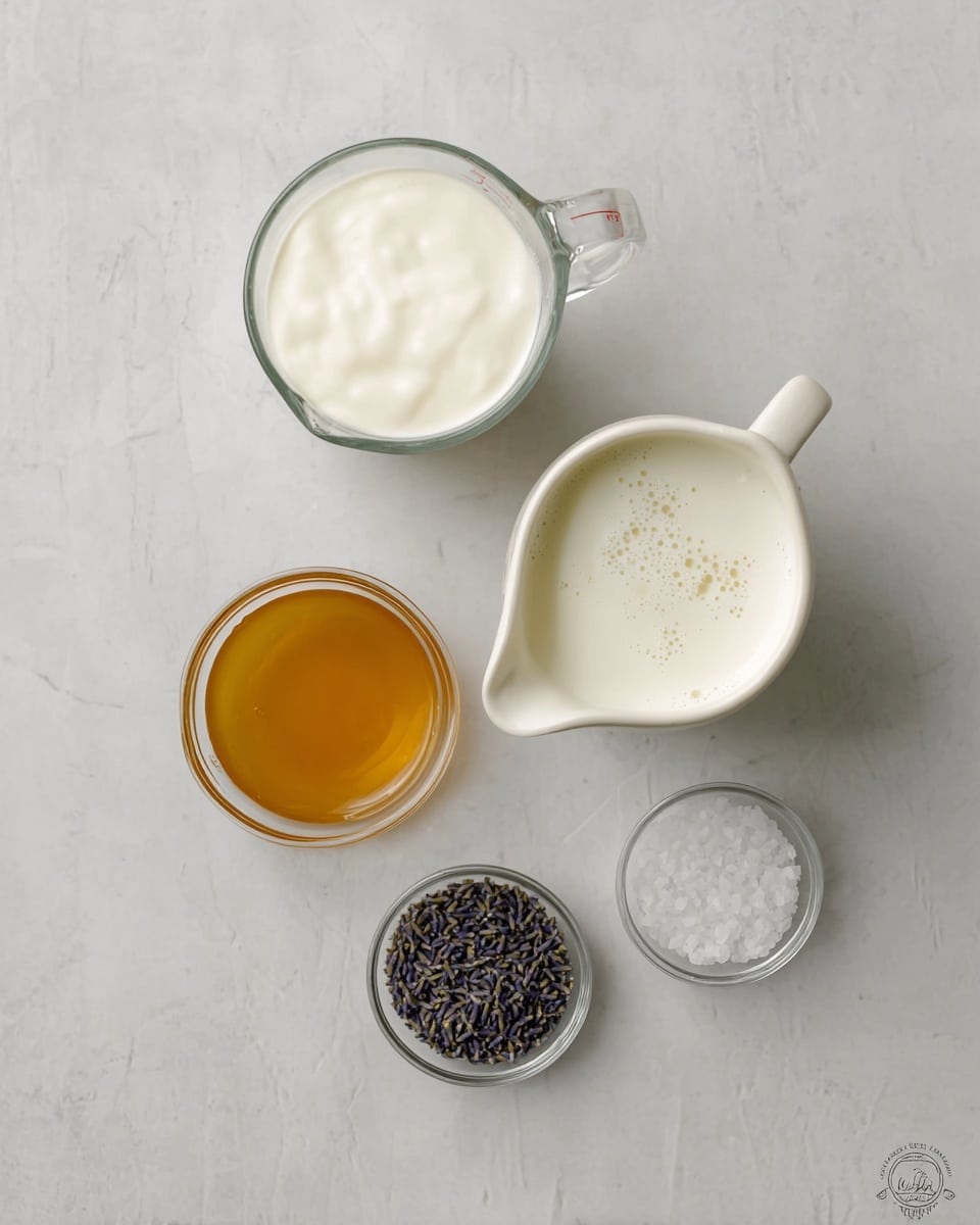 The image shows five containers with different ingredients arranged on a white marbled surface. At the top left is a clear glass measuring jug filled with thick white cream. To its right is another clear glass measuring jug holding white milk with small bubbles on top. Below the cream jug, there is a white ceramic jug filled with golden honey, showing a smooth shiny texture. At the bottom right, there are two small clear glass bowls; one contains dried lavender buds that are deep purple and the other has coarse white salt. Each item is neatly spaced, giving a clean and organized look. Photo taken with an iphone --ar 4:5 --v 7