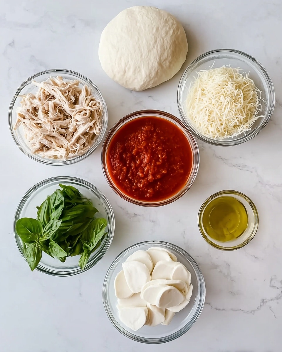 A top-down view of seven clear glass bowls arranged on a white marbled surface, each containing a different pizza ingredient. Starting from the top left, shredded rotisserie chicken in a bowl shows light beige strands with a soft texture. To the right, a bowl holds a smooth, slightly puffy ball of white pizza dough. Below the chicken, a bowl of fresh basil leaves with bright green color and smooth texture is shown. Moving right, a bowl filled with finely grated Parmesan cheese has a powdery, off-white appearance. Below the basil, a bowl with rich red marinara sauce has a thick, slightly textured surface. To its right, a smaller bowl with golden olive oil shows a clear, shiny liquid. Finally, at the bottom right, a bowl holds several white slices of fresh mozzarella cheese, smooth and slightly shiny. Photo taken with an iphone --ar 4:5 --v 7