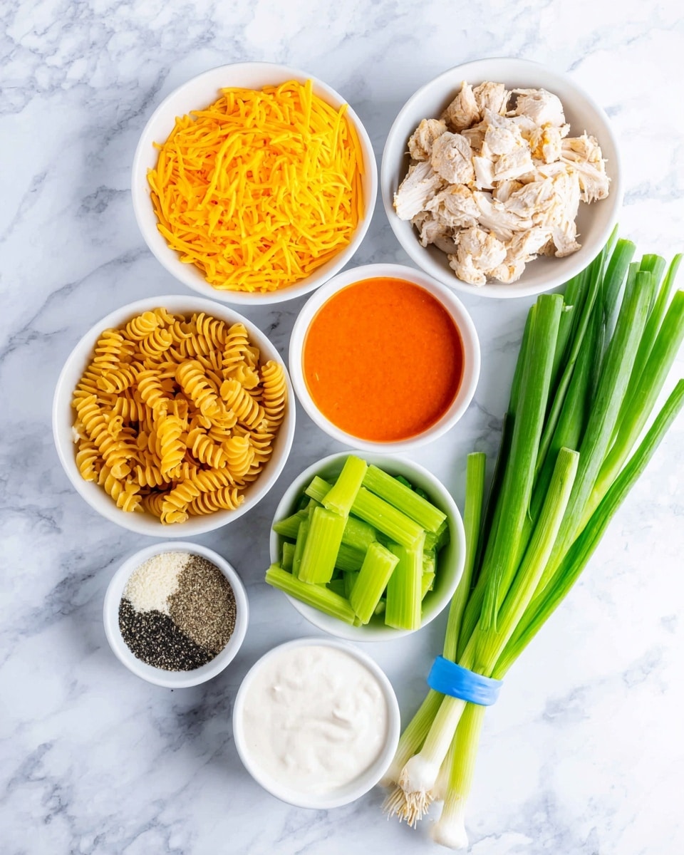 The image shows several small white bowls on a white marbled surface, each holding different ingredients neatly arranged. There is a bowl of shredded bright yellow cheese at the top left, next to a bowl containing light beige cooked chicken pieces with a bit of black seasoning. Below them is a bowl filled with bright orange sauce, and beside it is a bowl of sliced fresh green celery. Under the orange sauce bowl, there is a bowl with creamy white sauce. To the left, dry yellow spiral pasta is spread out, and a small white dish holds a mix of black pepper and grated cheese powder. On the right side of the image, a fresh bunch of green onions tied with a blue band lies diagonally. Photo taken with an iphone --ar 4:5 --v 7