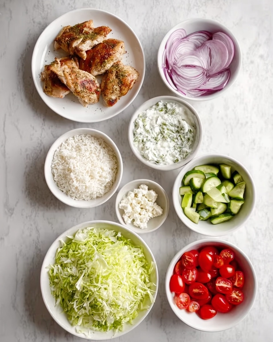 The image shows a white round plate with three cooked chicken pieces sprinkled with seasoning, placed near the top left. Around it, there are seven white bowls arranged on a white marbled surface. At the top right, one bowl has thinly sliced red onions with a smooth texture. Below it, a larger bowl holds a white creamy mixture, lightly speckled with herbs. To the left of this creamy bowl, a smaller bowl contains crumbly white cheese. Below these, a bowl filled with finely shredded green lettuce is placed near the center. On the right, a bowl with green cucumber chunks sits just beside a bowl of bright red cherry tomatoes. At the bottom left, a bowl contains plain white rice, slightly fluffy in texture. All bowls and the plate are arranged neatly, showing colorful fresh and cooked ingredients in clear detail. Photo taken with an iphone --ar 4:5 --v 7