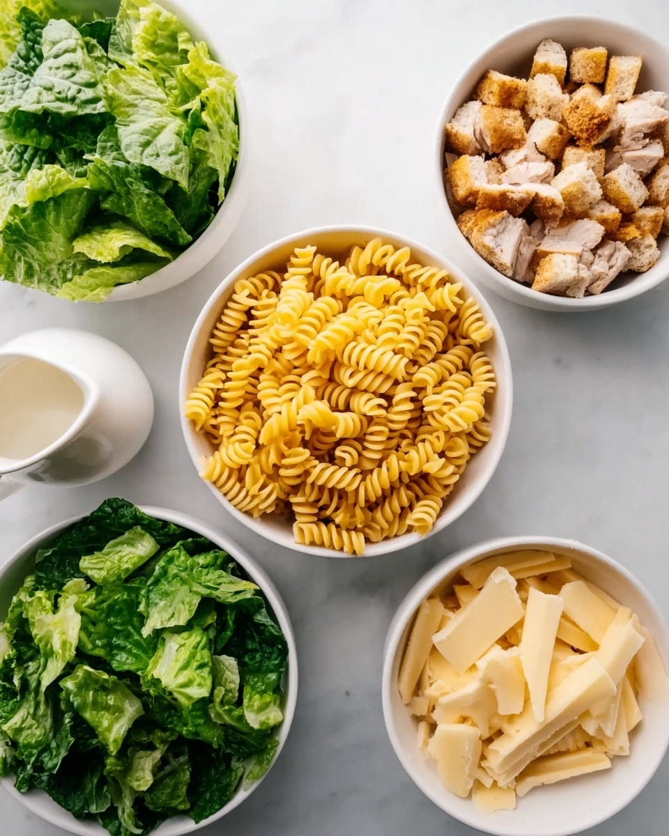 A top view of five white bowls placed on a white marbled surface, each bowl holding different food ingredients. In the center, a bowl is filled with yellow spiral pasta. Surrounding it, one bowl contains bright green leafy lettuce, another holds small pieces of grilled chicken with a light brown color, a third bowl is filled with light golden croutons, and the last bowl contains thin, pale yellow cheese slices. There is also a small white sauce pitcher in the upper left corner. Photo taken with an iphone --ar 4:5 --v 7