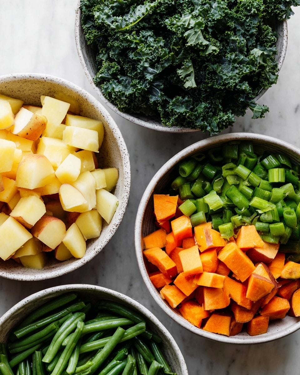 Four white bowls with speckled edges sit on a white marbled surface. The top right bowl is filled with dark green curly kale leaves, full and textured. The bottom right bowl contains a mix of cubed light yellow potatoes and orange sweet potatoes with skin on some pieces. The bottom left bowl holds bright green cut green beans that are shiny and fresh. The top left bowl has small chopped pieces of light green celery on the upper half and orange carrot cubes on the lower half. Photo taken with an iphone --ar 4:5 --v 7