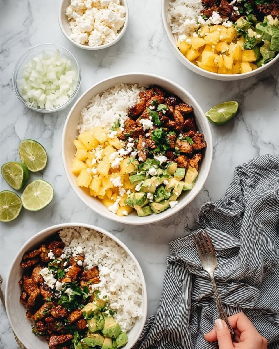 The image shows three white bowls on a white marbled surface, each filled with a colorful layered dish. Each bowl contains a base layer of white rice with a fluffy texture. On top of the rice, there are three sections: a portion of bright yellow pineapple chunks, a mix of green avocado pieces, and a top layer of browned cooked meat chunks with a slightly crispy texture. Small bits of white onion and fresh green herbs are sprinkled over the meat. Around the bowls, there are lime halves, a small bowl of white chopped onions, a small bowl of crumbly white cheese, and a gray-striped cloth on the right side. A woman's hand holds a fork near one of the bowls. The light is soft and natural, with no harsh shadows. photo taken with an iphone --ar 4:5 --v 7