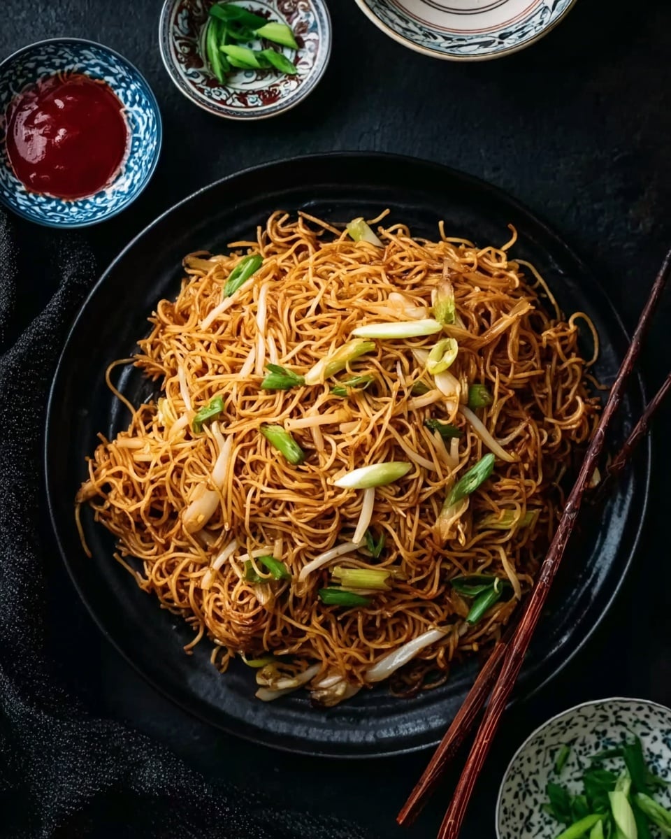 A black round plate filled with stir-fried thin noodles that are golden brown and slightly crispy. There are light bean sprouts and green onion slices mixed in, creating a contrast of white and green on top of the noodles. The plate is set on a dark surface with a pair of wooden chopsticks resting on the edge of the plate. Around the plate, there is a small white bowl with red chili sauce, a white bowl with a blue pattern, and a small white bowl with chopped green onions. The scene is well lit to show the textures and colors clearly, photo taken with an iphone --ar 4:5 --v 7