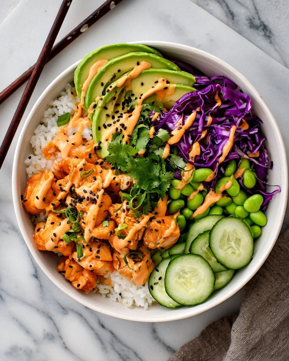 A white bowl filled with five main layers arranged side by side: white rice on the top right, orange pieces of cooked chicken with some green cilantro leaves on top, sliced green cucumber rounds at the bottom right, bright green edamame beans scattered near the cucumber and rice, and thin strips of purple cabbage and orange carrot pieces beneath sliced avocado. The avocado is fanned out and placed on the top left side. A creamy orange sauce is drizzled across the chicken, avocado, and edamame, with small black sesame seeds sprinkled on top. The bowl is placed on a white marbled surface with dark wooden chopsticks resting beside it, and part of a woman's hand is visible holding the chopsticks near the top left edge. Photo taken with an iphone --ar 4:5 --v 7