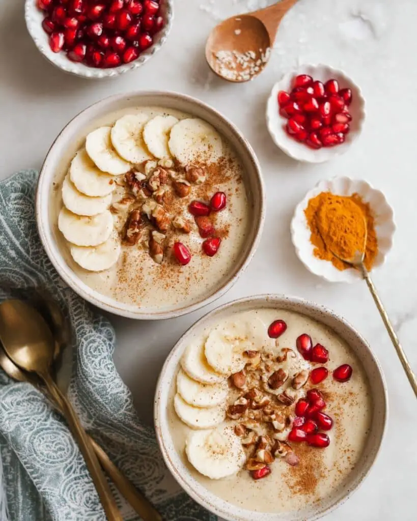 Creamy Cinnamon Quinoa Porridge with Banana, Pomegranate, and Nuts Recipe
