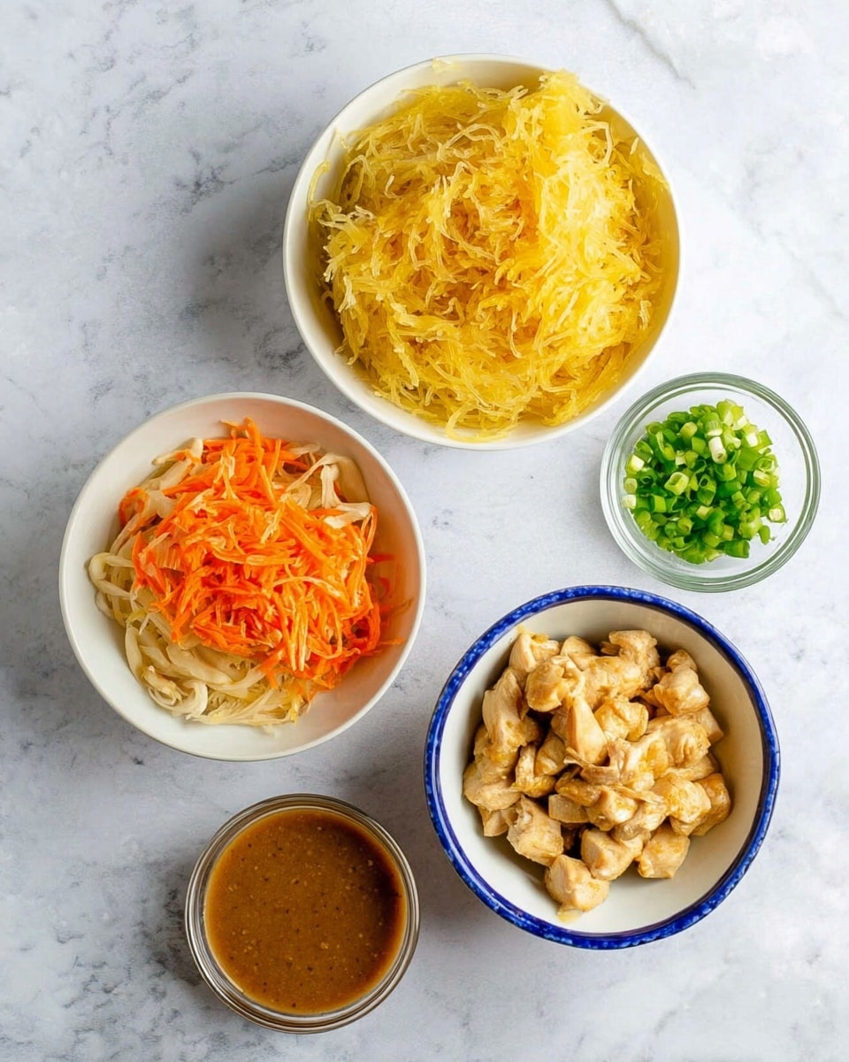The image shows a top-down view of five bowls on a white marbled surface. The largest white bowl on the top right holds a single layer of golden-yellow cooked spaghetti squash with a slightly shredded texture. On the bottom left, a white bowl contains a mixed layer of orange carrot strips and light beige chopped onions. To the bottom right, a white bowl with a blue rim has small, lightly browned chunks of cooked chicken pieces. Above the white bowl with chicken, a small clear glass bowl is filled with dark green, chopped scallions. Below the bowls, a small clear glass container holds a smooth, brown sauce. Photo taken with an iphone --ar 4:5 --v 7