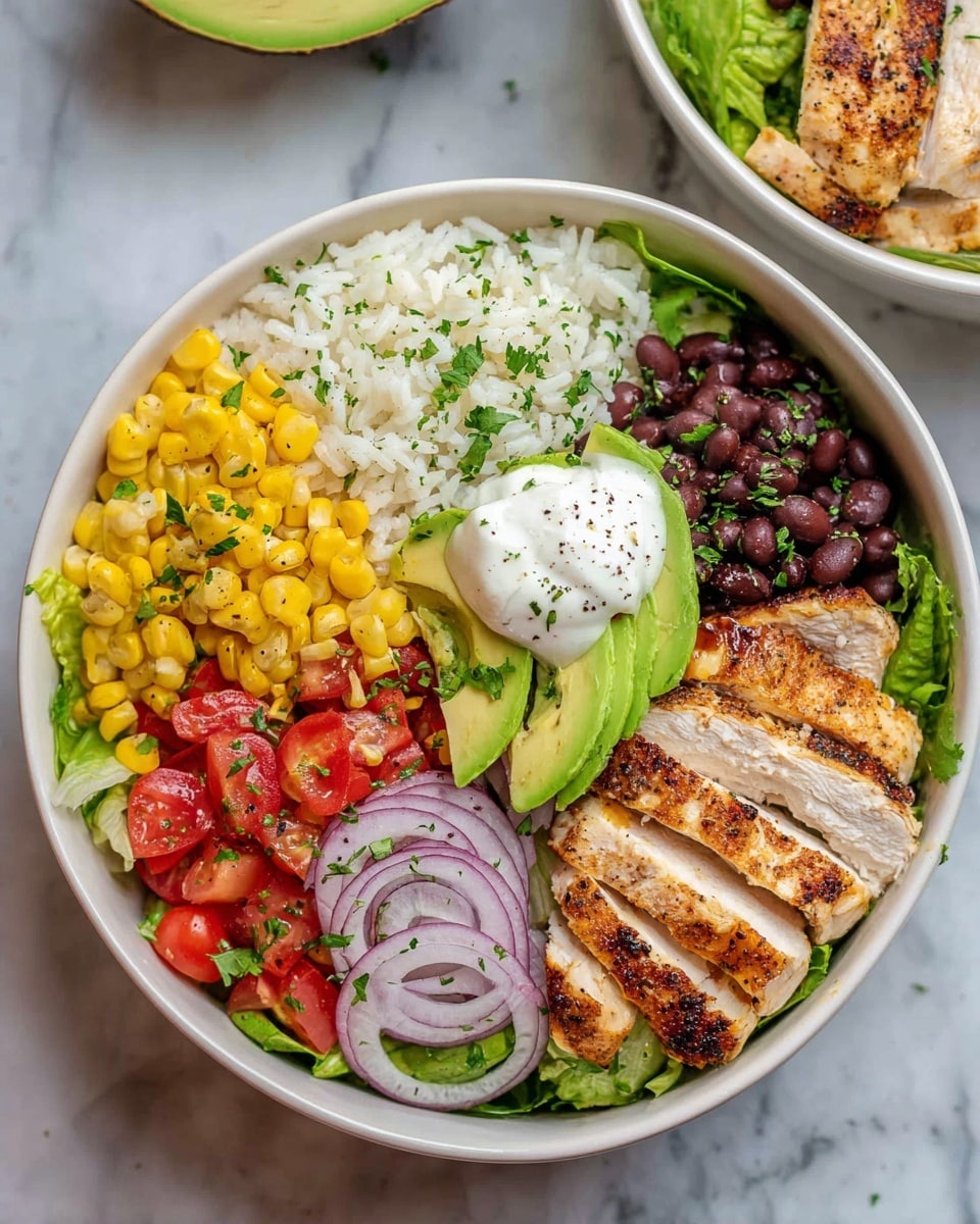 The image shows a white bowl filled with layers of food arranged in sections: at the bottom is a layer of green lettuce leaves, on top of it is grilled chicken sliced into strips, placed on the right side. Next to the chicken are black beans and thin rings of red onion. To the left of the black beans, there are chopped red tomatoes mixed with small green pieces. Above the tomatoes, a layer of white rice lightly sprinkled with herbs fills the top left part of the bowl. Below the rice, bright yellow corn kernels rest beside the chicken. On top of all these layers, two slices of green avocado sit with a dollop of white sour cream, sprinkled with small green herbs and black pepper. The bowl is placed on a white marbled surface with part of another bowl slightly visible in the top right corner. Photo taken with an iphone --ar 4:5 --v 7