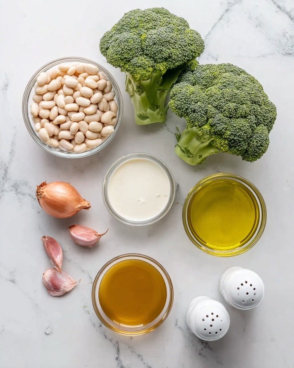 The image shows ingredients neatly arranged on a white marbled surface. In the top center, there are two fresh green broccoli heads with detailed, textured florets. Below them is a small clear glass bowl filled with pale white beans. To the right of the beans is a small clear bowl with golden olive oil, showing a smooth shiny surface. Below the oil is a round clear glass bowl filled with white cream. To the left of the cream bowl, there is a larger clear glass bowl with a warm brown broth. On the bottom left, there are two small shallots with pinkish brown skins and a round white garlic bulb with its papery texture visible. Close to the bottom right, a pair of white salt and pepper shakers sit side by side. The whole scene is bright and clean with simple natural colors. photo taken with an iphone --ar 4:5 --v 7