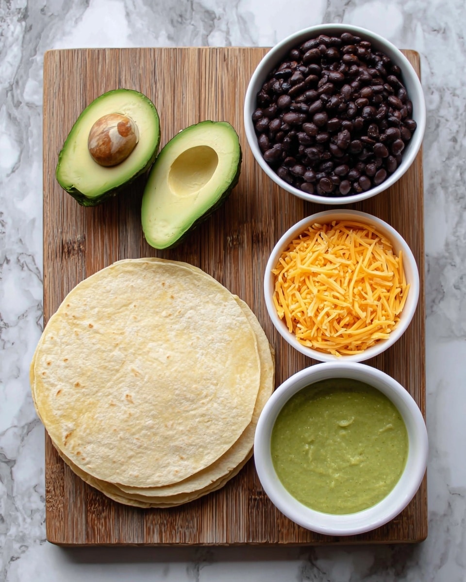 A wooden board on a white marbled surface holds a stack of pale yellow tortillas on the left, two halves of a green avocado with one seed in the lower half near the center, and three white bowls arranged on the right side: the top one filled with glossy dark black beans, the bottom right one filled with bright orange shredded cheese, and the bottom left one filled with smooth green sauce, creating a neat and colorful display photo taken with an iphone --ar 4:5 --v 7