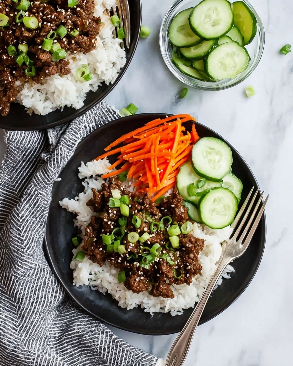 The image shows two black plates with three layers each. The bottom layer is white rice, fluffy and slightly sticky. On top of the rice, there is a layer of dark brown cooked beef mixed with chopped green onions and sprinkled with white sesame seeds. The top layer on one plate has thin orange carrot strips and light green cucumber slices arranged neatly. A fork rests on this plate, and beside the plates, there is a small glass bowl filled with cucumber slices. The background is a white marbled surface with a striped gray and white cloth nearby. Photo taken with an iphone --ar 4:5 --v 7