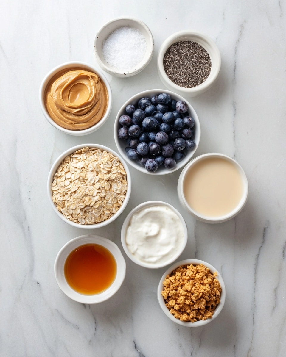 The image shows nine small white bowls arranged on a white marbled surface, each holding a different ingredient. Starting from the center, a bowl filled with light brown rolled oats is placed near the bottom left; moving clockwise, a bowl with dark blue blueberries sits to the right, followed by a bowl of creamy beige liquid. Above it, a bowl contains small black chia seeds, and next to that is a small bowl of white coarse salt. To the left, there is a bowl holding thick, smooth peanut butter, then a bowl with thick white yogurt. At the bottom left near the oats, a bowl has amber liquid syrup, next to it, a bowl with crunchy, crushed light brown textured cereal, and lastly another small bowl of similar amber liquid near the bottom right. The overall layout is neat and bright, showing a variety of colors and textures clearly. Photo taken with an iphone --ar 4:5 --v 7